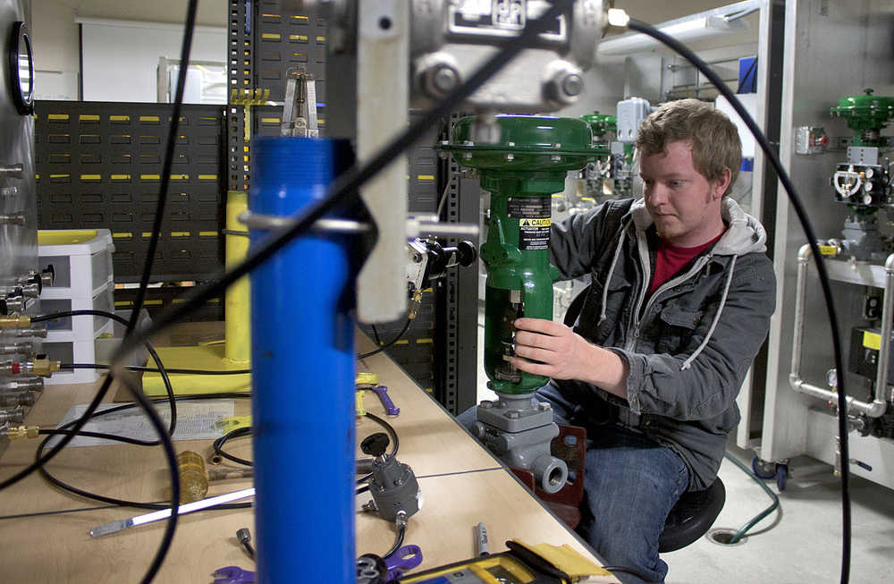 Photo byRashah McChesney/Peninsula Clarion  Cat Walsh, an instrumentation student, workes to build a database Wednesday Nov. 12, 2014 in the ... building at the Kenai Peninsula College Kenai River Campus in Soldotna, Alaska.