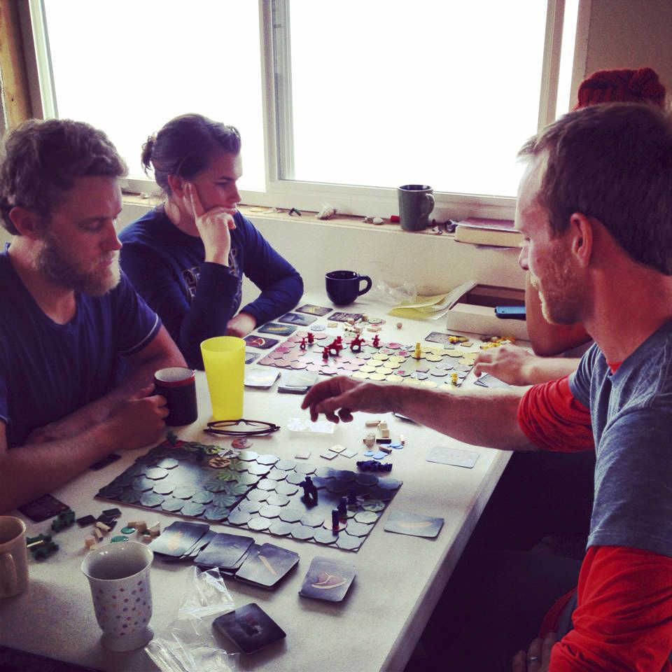 Contributed photo: Donica Nash A Kasilof setnet crew on a break plays Serfs and Soldiers  between picks. (Left)   Wesley Tullis Jr., Delissa Severson, Jonathan Hane , and, Shea Nash.