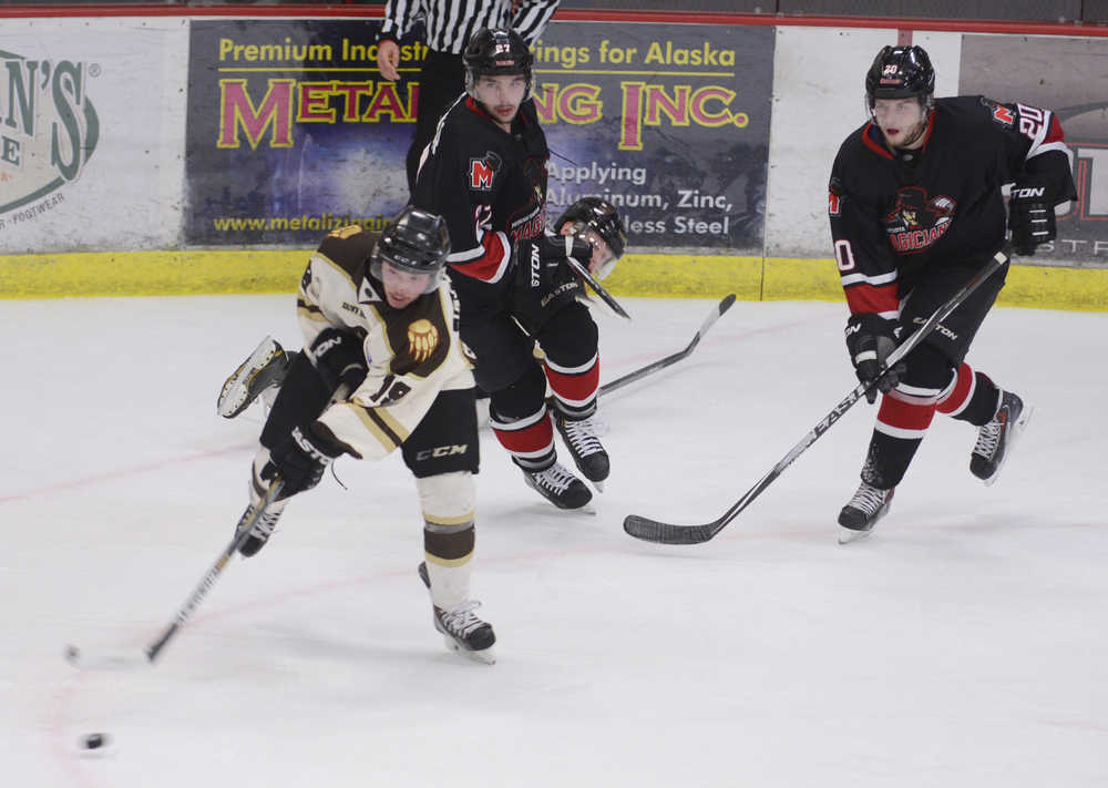 Photo by Kelly Sullivan/ Peninsula Clarion Kenai Brown Bears' Alex Jackstadt races away from Minnesota Magicians' with control of the puck Friday, November 14, 2014 at the Soldotna Regional Sportd Complex in Soldotna, Alaska.