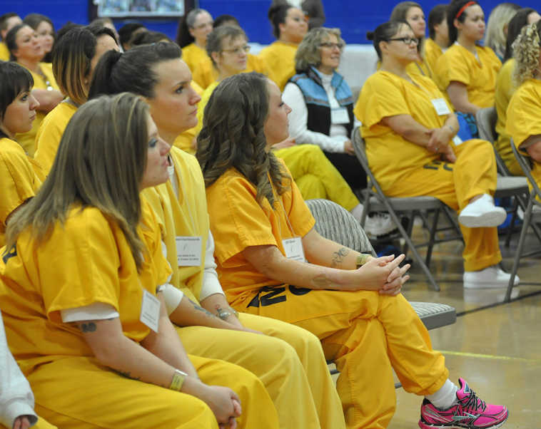 ADVANCE FOR USE SUNDAY, NOV. 9 - In this photo taken Oct. 25, 2014, Hiland Mountain Correctional Center inmates listen as former inmates offer tips for transitioning out of prison life during the "Probation Tips for Success" session in Eagle River, Alaska. The Hiland inmates attended the workshop sessions as part of the Success Inside & Out agenda. In its ninth year, the program highlights tips and coping strategies for pre-release inmates, offering panels and classes in such areas as probation tips, educational horizons, child custody and re-entry support. (AP Photo/Chugiak Eagle River Star, Cinthia Ritchie)