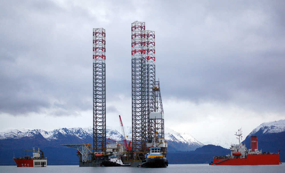 The 765-foot Zhen Hua 15 loads the jack-up rig Endeavour-Spirit of Independence in Kachemak Bay off the Homer Spit on Monday. The Zhen Hua 15 is a float-on, float-off heavy-lift vessel that sinks part way to allow equipment like the Endeavour to be loaded on.