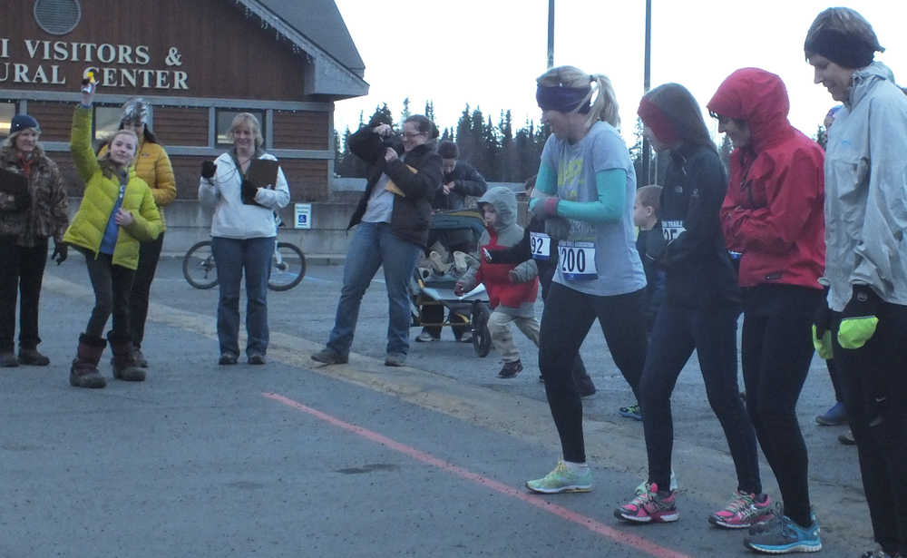 Ben Boettger/Peninsula Clarion Participants gather at the starting line for Emma's Run at the Kenai Visitors Center on Saturday, Nov. 22.