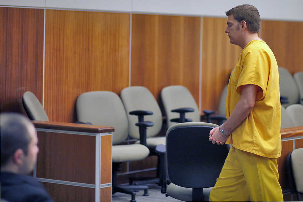 Photo by Rashah McChesney/Peninsula Clarion Jeremy Anderson, former Nikiski Middle-High School student music teacher accused of raping one of his students, walks out of a Kenai courtroom Tuesday Nov. 25, 2014 in Kenai, Alaska.