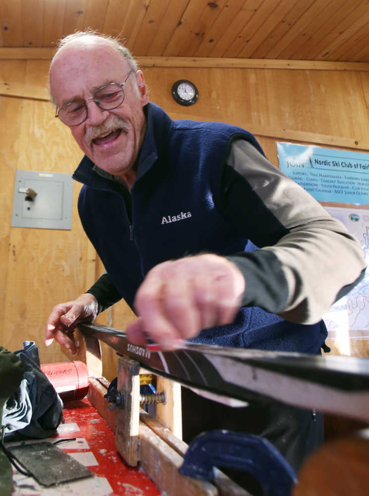 ADVANCE FOR WEEKEND EDITIONS, NOV. 29-30 - In this photo taken on Nov. 17, 2014, Nordic ski instructor Tim Buckley demonstrates applying kick wax as he works with beginning classic cross country skiing students from the Osher Lifelong Learning Institute at UAF during their class at Birch Hill Recreation Area in Fairbanks, Alaska.  Buckley, 70, is a lifelong skier and has been teaching both classic and skate techniques to children and adults for 15 years. Buckley is the Spotlight for the week.  (AP Photo/Fairbanks Daily News, Miner, Eric Engman)