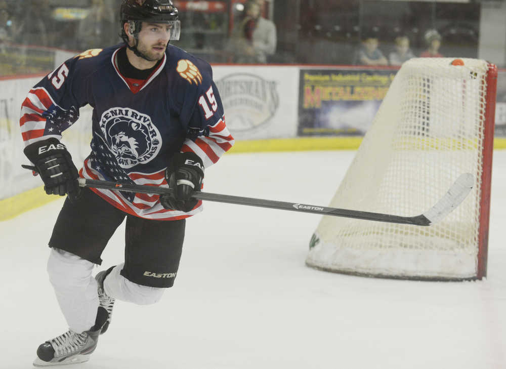 Photo by Kelly Sullivan/ Peninsula Clarion  Kenai River Brown Bears' number 15 Maurin Bouvet races after the action during a game against Wenatchee Wild Friday, Nov. 21, 2014 at the Soldotna Regional Sports Complex in Soldotna.