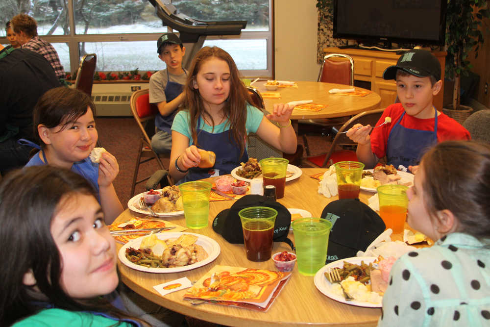 Hilcorp employees treat Kenai Seniors to pre-Thanksgiving dinner