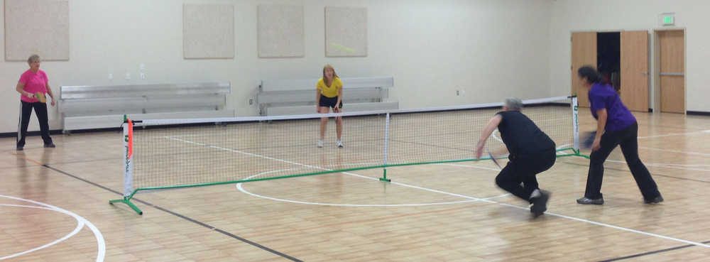 A group of people play pickleball at the Sterling Community Center.