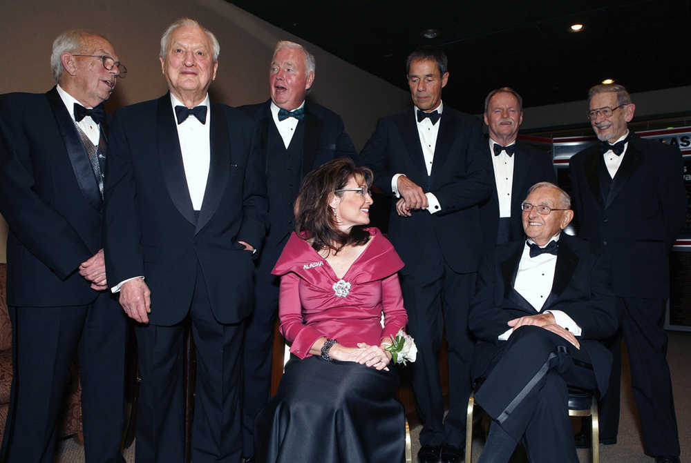 FILE - In this Nov. 14, 2008, file photo, former Alaska governors Bill Sheffield, left, Walter J. Hickel, Frank Murkowski, Tony Knowles, Steve Cowper, and Keith Miller, right, with then Gov. Sarah Palin, front left, and Territorial Gov. Mike Stepovich, front right, talk as they wait for a ceremony to honor Alaska governors as part of Alaska's 50th anniversary in Anchorage, Alaska. Bill Walker became the 13th governor of Alaska this week. Or its 11th governor. Or 16th or 17th. It depends on how you count. As it turns out, the state of Alaska doesn't appear to have an official way of counting governors and their terms. (AP Photo/Al Grillo, File)