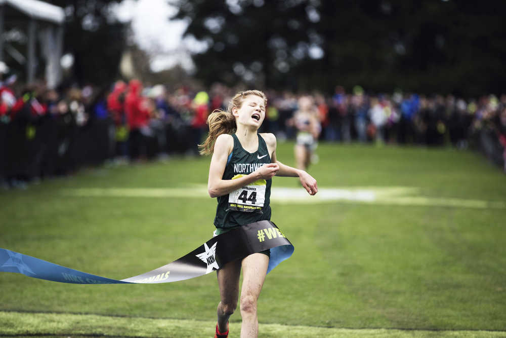 Contributed photo by Nike  Allie Ostrander, of Kenai, wins the girl's championship title at the 2014 Nike Cross Nationals in Portland, Oregon.