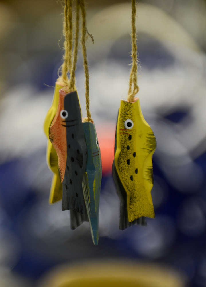 Photo by Rashah McChesney/Peninsula Clarion  Clay fish dangle from a wind chime at the Kenai Potters Guild sale Saturday Dec. 6, 2014 in Kenai, Alaska. The Guild holds intermittent sales and will hold another one on Mother's Day.