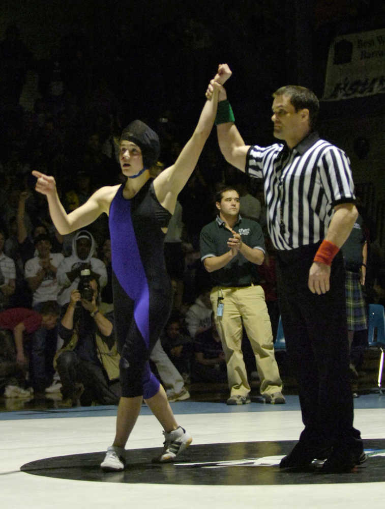 Skyview High School's Michaela Hutchison's hand is raised in victory Feb. 4, 2006 as she becomes the first girl to win a state championship wrestling competition in the United States during the State 4A Wrestling Championships at Chugiak High School. (Clarion file photo)