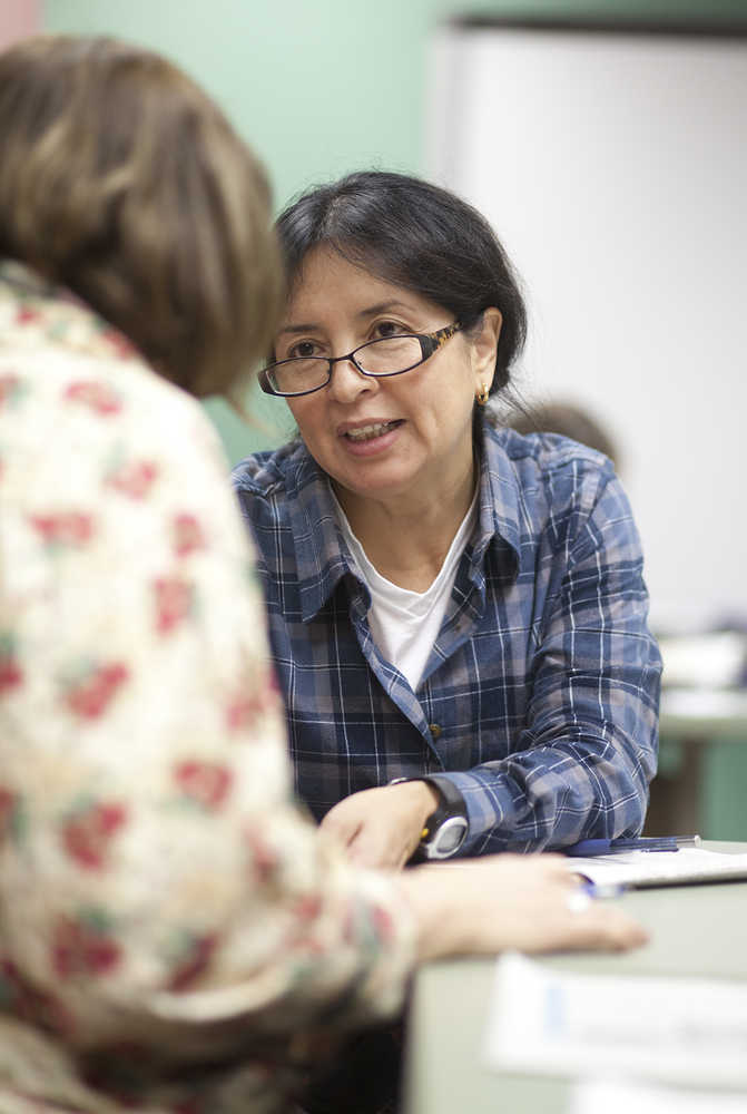 Photo by Rashah McChesney/Peninsula Clarion  At the end of a class, English as a Second Language students worked on a crossword puzzle on Thursday Dec. 11, 2014 at Kenai Peninsula College Kenai River Campus in Soldotna, Alaska.
