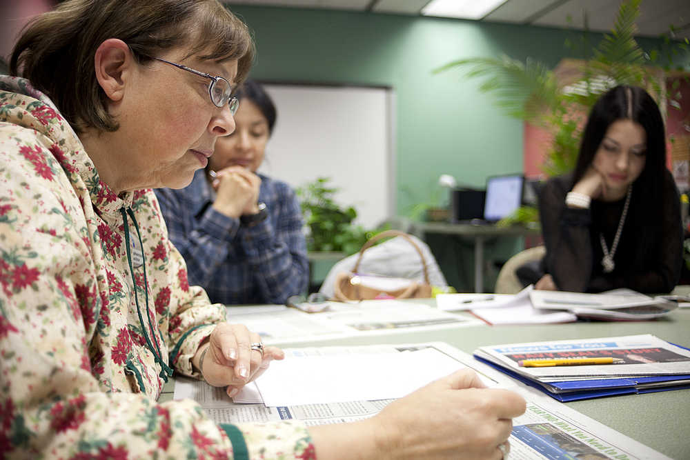 Photo by Rashah McChesney/Peninsula Clarion  English as a Second Language instructor Kathy Christopherson adds to a list of homophones during a class on Thursday Dec. 11, 2014 at Kenai Peninsula College Kenai River Campus in Soldotna, Alaska.