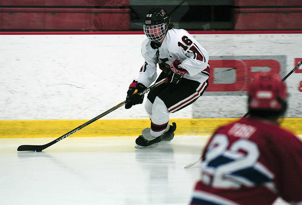 Photo by Rashah McChesney/Peninsula Clarion Kenai Central High School's  Dalton Dosko looks for an opening during a game against Anchorage's East High School on Friday Dec. 12, 2014 at the Soldotna Sports Complex in Soldotna, Alaska.