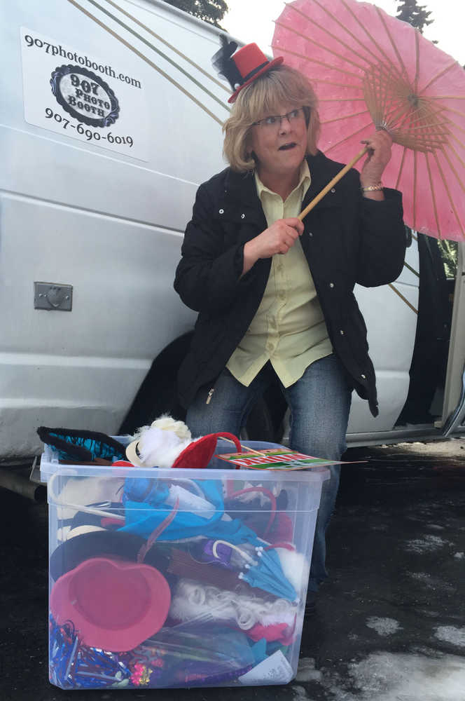 By IAN FOLEY/Peninsula Clarion Teresa Kiffmeyer rummages through a box of props on Monday, December 15, 2014 in Soldotna.