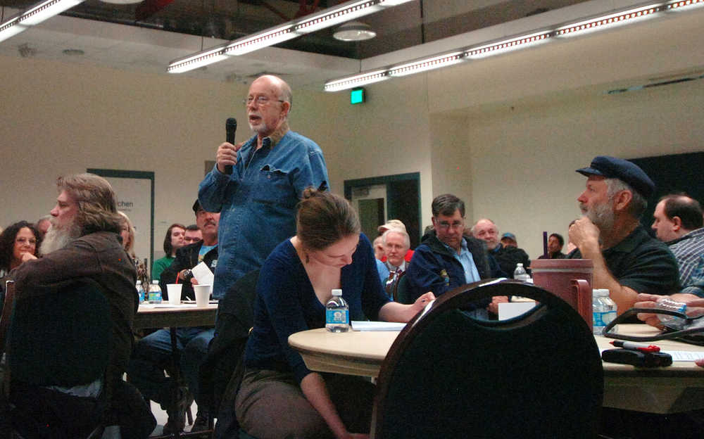 Photo by Dan Balmer/Peninsula Clarion Nikiski resident Bill Warren comments at a town hall meeting organized by the Kenai Community Coalition on Cannabis Tuesday, Dec. 16, 2014 at the Challenger Learning Center in Kenai. Warren, who said he voted against legalization, expressed his concerns on the impact marijuana use could have on the Kenai Peninsula workforce.