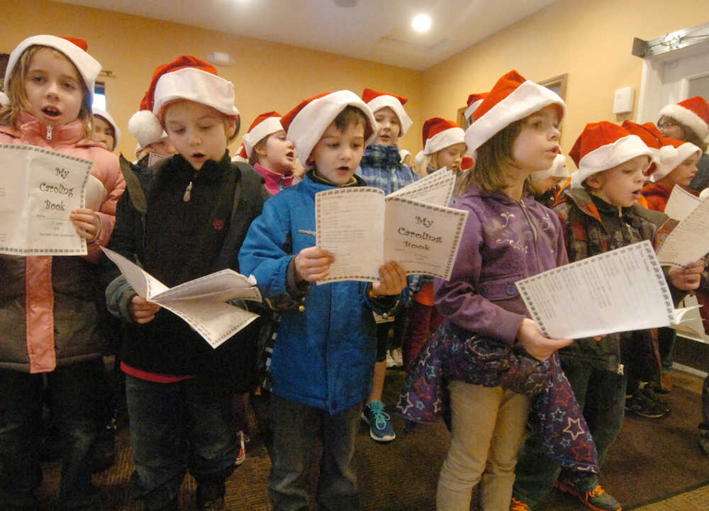 Photo by Kelly Sullivan/ Peninsula Clarion Students from Mountain View Elementary School sing "All I want for Christmas is my two front teeth," to an attentive audience at Charis Place Assisted Living Wednesday, Dec. 17, 2014 in Kenai, Alaska.