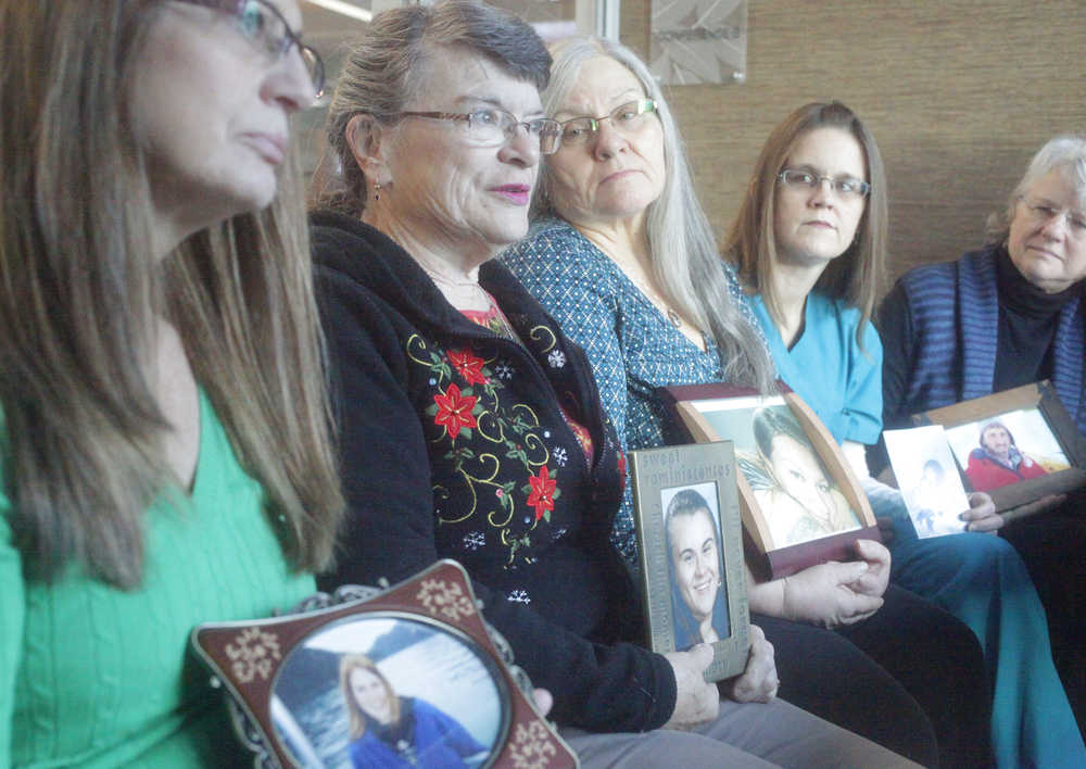 Photo by Kelly Sullivan/ Peninsula Clarion Compassionate Friends of the Kenai Peninsula steering committee members discuss details of the first candle lighting vigil the group hosted at Christ Lutheran Church Sunday evening on Saturday, Dec. 20, 2014 at the Joyce K. Carver Soldotna Public Library in Soldotna, Alaska. The committee normally sits in an open circle so nothing is standing between each other when they have their discussions, member Brenda Zuck said.