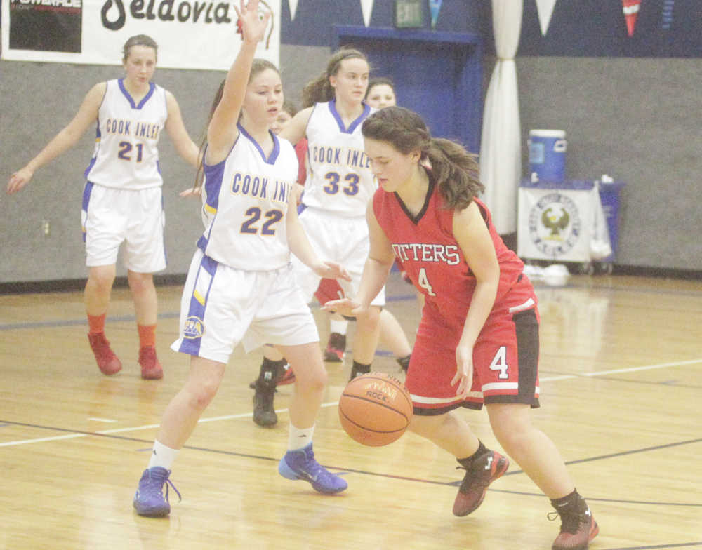 Photo by Kelly Sullivan/ Peninsula Clarion Cook Inlet Academy Eagle's Emma Lyons attempts to block Seldovia Lady Sea Otters Marina Chissus Saturday, Dec. 20, 2014, at Cook Inlet Academy in Soldotna, Alaska.