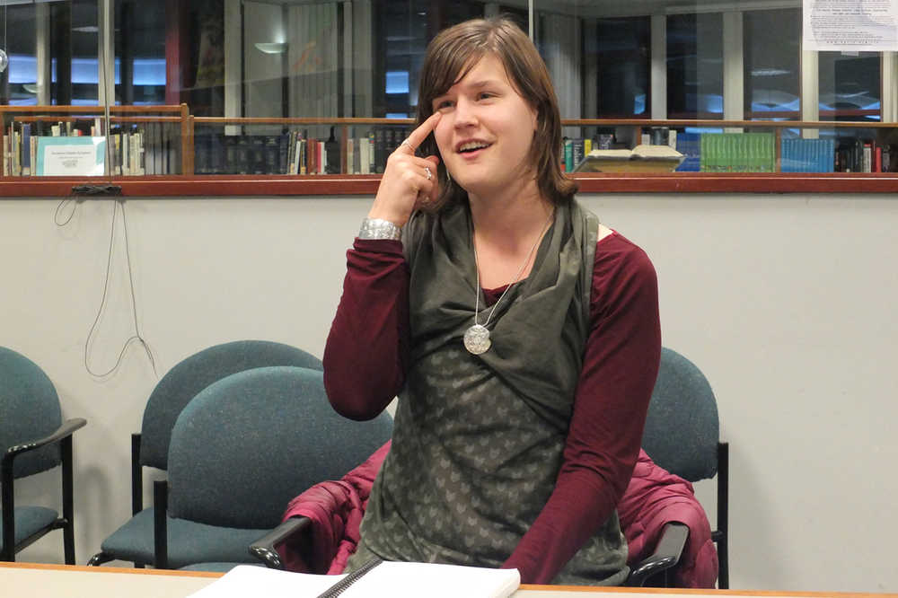 Mallory Story, a University of Alaska Southeast 2014 Outstanding Graduate in social sciences, sings "Head, Shoulders Knees and Toes" in Tlingit as students in a free Tlingit language workshop sing along. Story, Will Geiger, and Richard Radford are Tlingit students leading the workshop at Juneau's downtown library each Monday. (AP Photo/Capital City Weekly, Mary Catharine Martin)