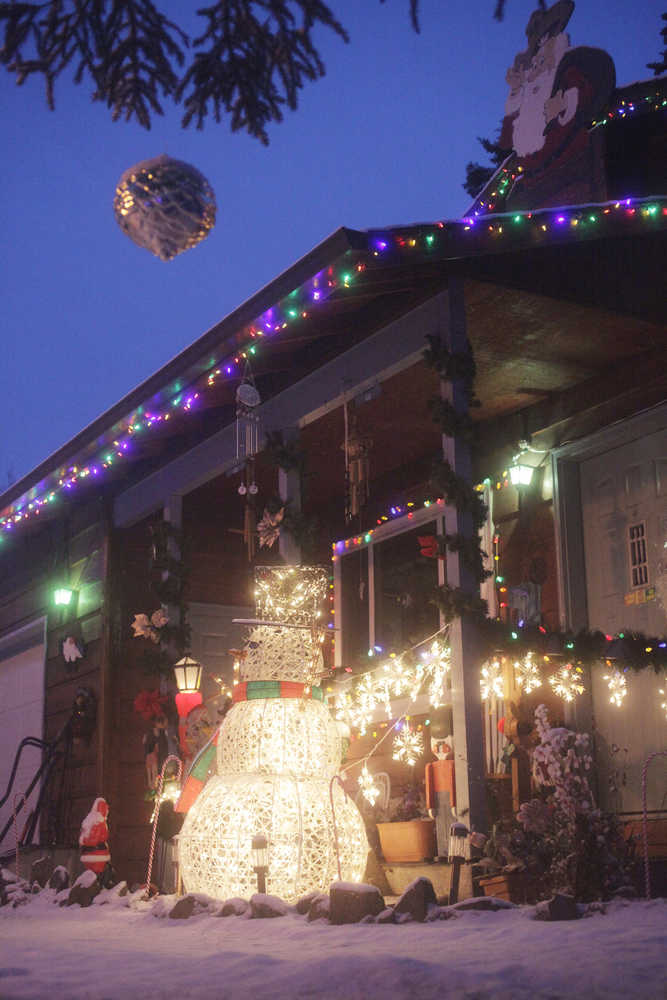 Photo by Kelly Sullivan/ Peninsula Clarion Tara Chipman said it takes her family about three hours to complete their annual Christmas decorations, shown here on  Monday, Dec. 22, 2014, on Rogers Road in Kenai, Alaska. Halloween and Christmas are the two holidays Chipman "decks out" the house for, she said. The interior of the home receives attention as well, she said.