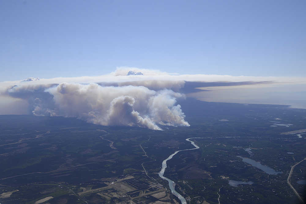 Photo by Rashah McChesney/Peninsula Clarion Smoke from the Funny River Fire reached more than 8,000 feet in the air Tuesday May 20, 2014 as the fire burned more than 7,000 acres of Kenai National Wildlife Refuge land in 24 hours. The line of fire stretched more than 10 miles long from Funny River Road to Tustumena Lake on the Kenai Peninsula.