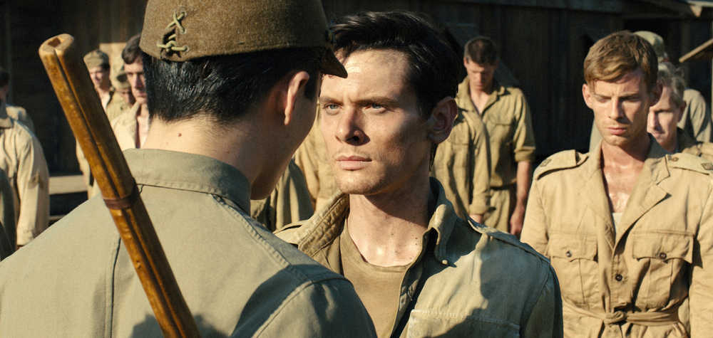 In this image released by Universal Pictures, Jack O'Connell portrays Olympian and war hero Louis "Louie" Zamperini in a scene from "Unbroken." The film, directed by Angelina Jolie, did not receive any Golden Globe nominations on Thursday.  (AP Photo/Universal Pictures)