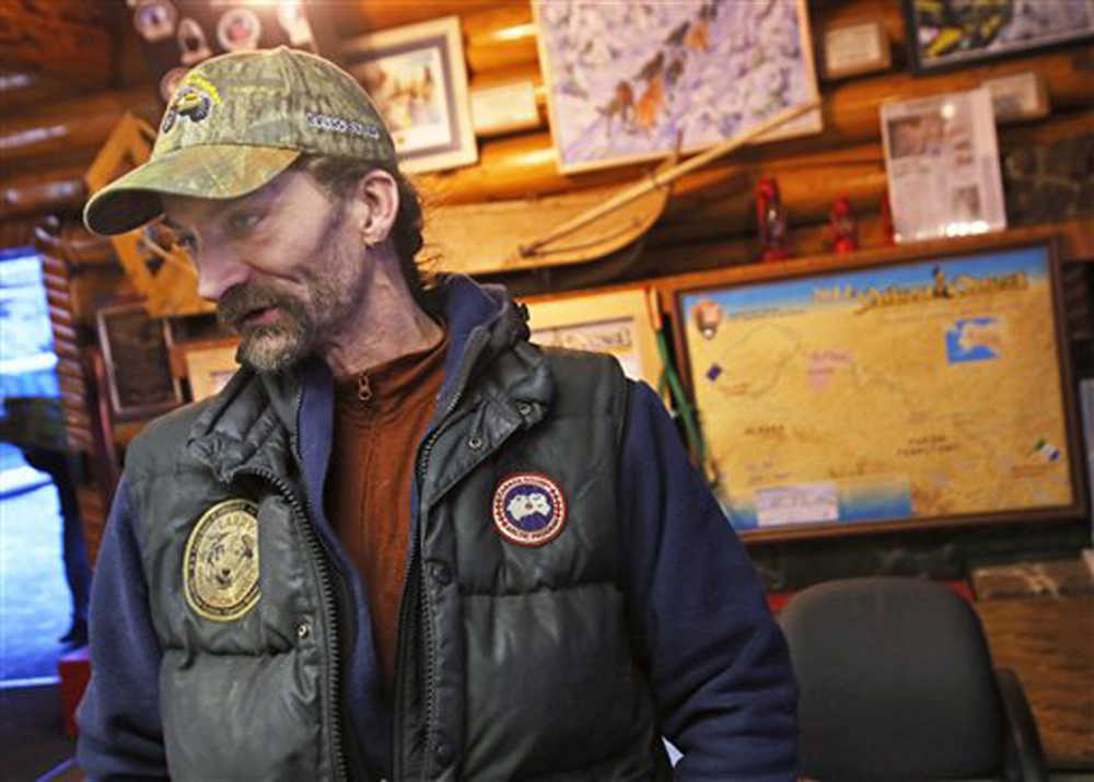 Four-time champion Lance Mackey talks about his entry into this year's Yukon Quest International Sled Dog Race at the Quest Visitor Center Fairbanks, Alaska, Monday, Dec. 29, 2014. Mackey is replacing rookie Jimmy Lebling as the driver of his Comeback Kennels dog team, which was already signed up for the race. (AP Photo/Fairbanks Daily News-Miner, Eric Engman)