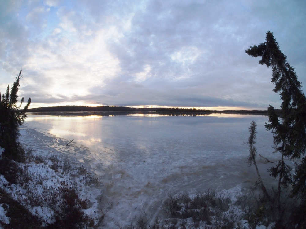 The morning sun on the last day of 2014 shows the sheen of water and ice on Headquarters Lake, a time of year in which the Kenai Peninsula would normally be blanketed in snow. (Kenai National Wildlife Refuge photo)