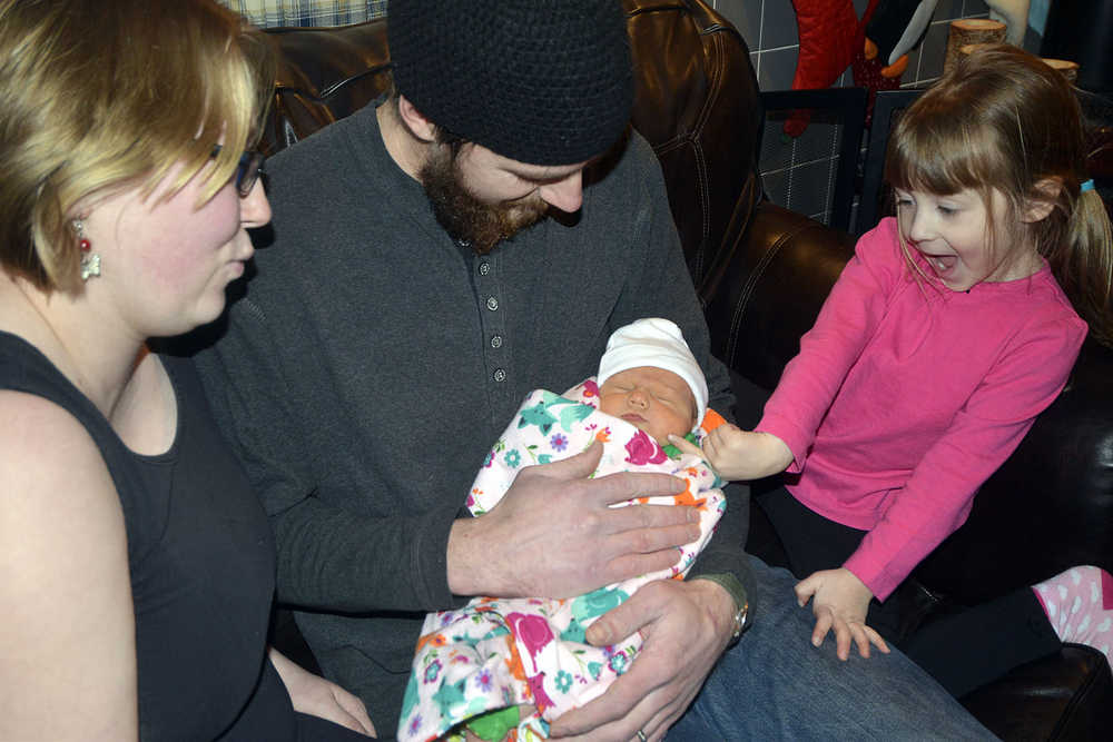 Photo by Dan Balmer/Peninsula Clarion JoAnna Ray Hadassah Chatham, born on Jan. 2, was the first baby born at Central Peninsula Hospital in 2015. JoAnna is the second child for Issac and Amber Chatham of Soldotna. Their firstborn daughter Mary-Katherine Chatham, 4, is on the right.
