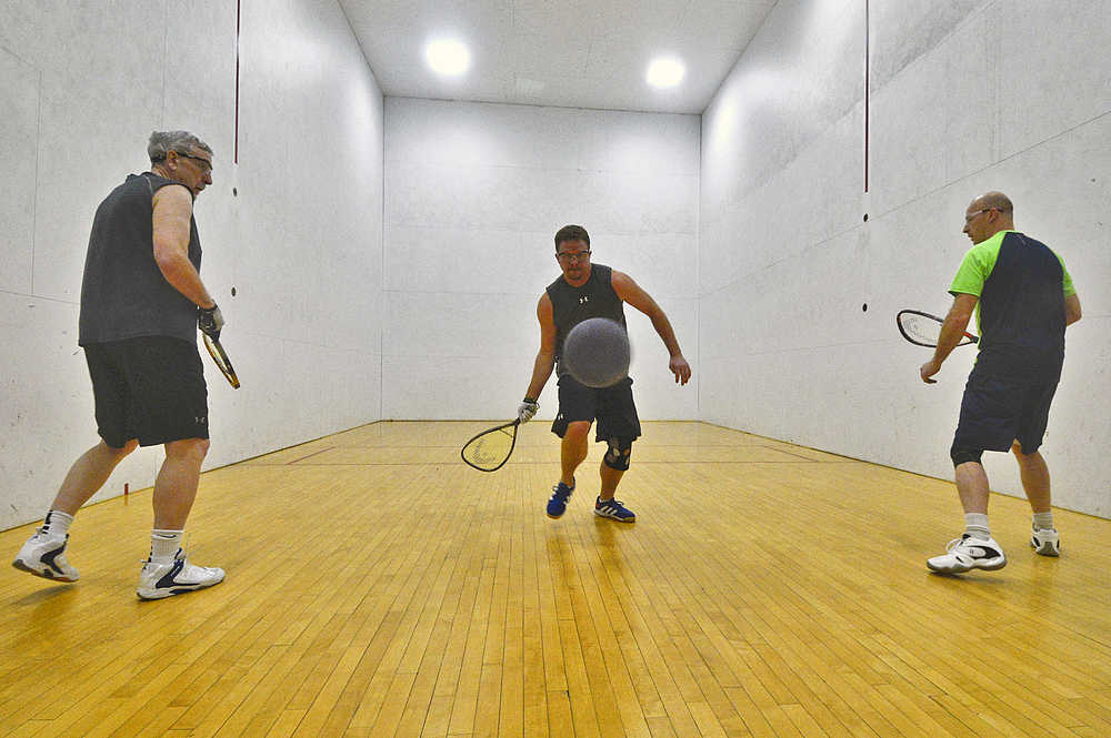 Photo by Rashah McChesney/Peninsula Clarion  (left)Carl Bauman, Jeremy Sorhus and Rob Meyer play racquetball at the Kenai Recreation Center Tuesday Jan. 6, 2014 in Kenai, Alaska. A group typically meets to play on Saturday from 9 a.m. to 11 a.m.