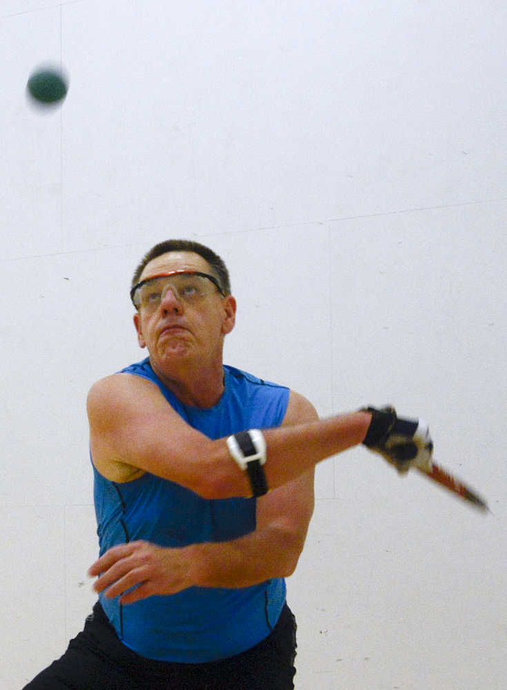 Photo by Rashah McChesney/Peninsula Clarion  Doug Haralson warms up for a game of racquetball at the Kenai Recreation Center Tuesday Jan. 6, 2014 in Kenai, Alaska. A group typically meets to play on Saturday from 9 a.m. to 11 a.m, he said.