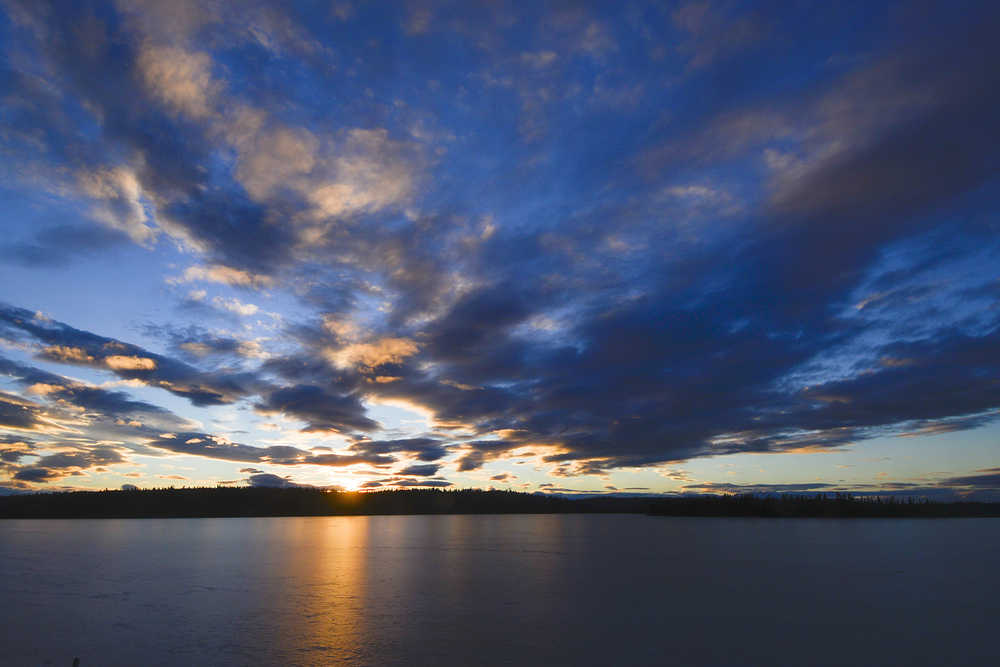 Photo by Rashah McChesney/Peninsula Clarion  The sun rises over Headquarters Lake near the Kenai National Wildlife Refuge visitors center on Friday in Soldotna. With sunrise at 10:02 a.m. and sunset at 4:25 p.m. today, the central Kenai Peninsula is gaining 3 minutes, 32 seconds of daylight.