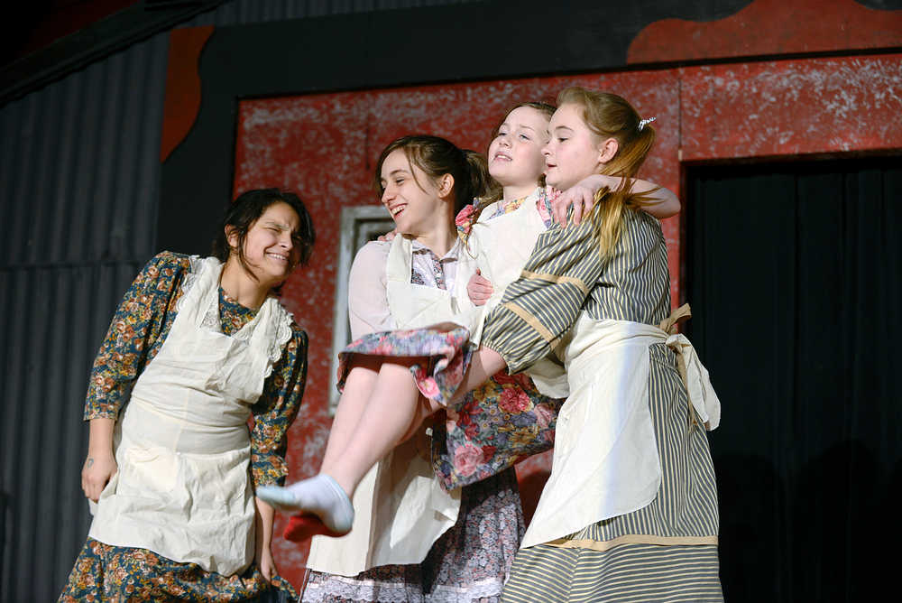 Photo by Rashah McChesney/Peninsula Clarion Cast members in the musical Annie held their first drest rehearsal on Tuesday Jan. 13, 2014 at the Triumvirate Theatre in Nikiski, Alaska. The show will open on Friday and run through Jan. 24.