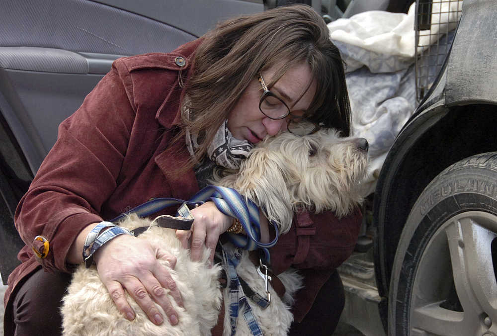 Photo by Rashah McChesney/Peninsula Clarion  France Bennet talks to a reporter about the experience of losing her wheaten terrier mix Didley on Thursday Jan. 15, 2014 in Sterling, Alaska.