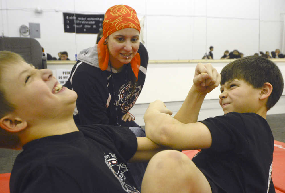 Photo by Rashah McChesney/Peninsula Clarion  Several children practice for a regional Native Youth Olympics event on Wednesday Jan. 14, 2015 at the Yaghanen Youth Center in Soldotna, Alaska. The Kenaitze Indian Tribe is holding the event during the 2015 Peninsula Winter Games.