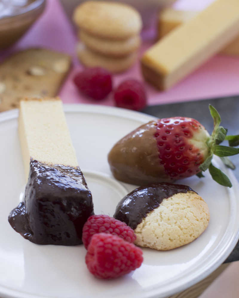 This Jan. 5, 2015 photo shows a fondue duo of chocolate mango and five spice caramel sauces in Concord, N.H. (AP Photo/Matthew Mead)