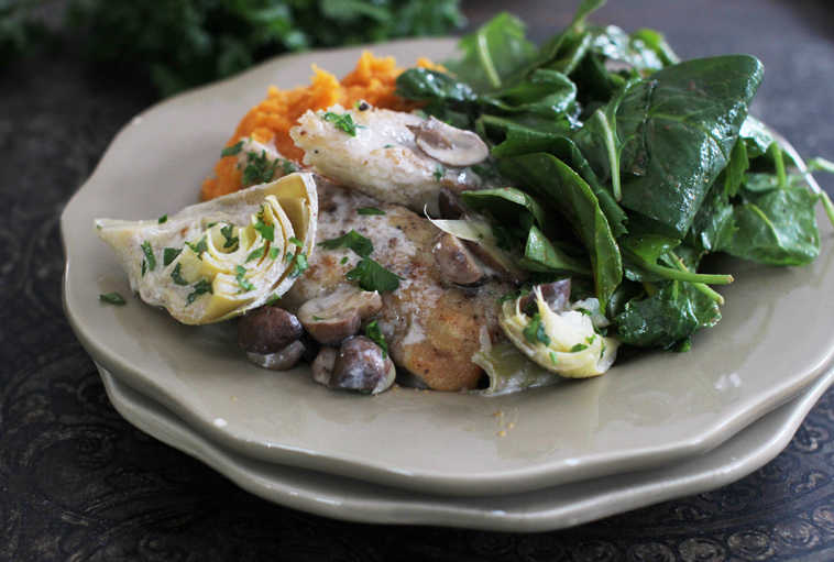 This Jan. 19, 2015 photo shows chicken with tangy artichoke and mushroom sauce in Concord, N.H. (AP Photo/MatthewMead)