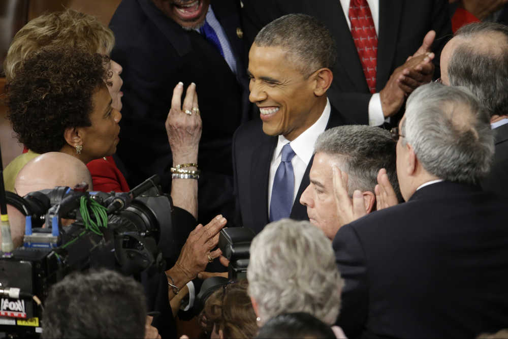 President Barack Obama is greeted on  Capitol Hill in Washington, Tuesday, Jan. 20, 2015, before his State of the Union address before a joint session of Congress. (AP Photo/Pablo Martinez Monsivais)