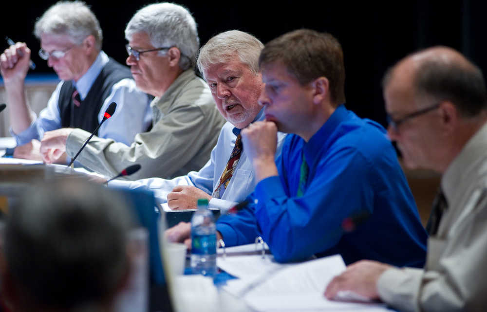 Chairman Karl Johnstone, center, runs a Alaska Board of Fisheries meeting at Centennial Hall on Wednesday. Along with Johnstone are board members Fritz Johnson, left, Tom Kluberton, second from left, Glenn Haight, Executive Director, second from right, and John Jensen. The meetings continue on Thursday.