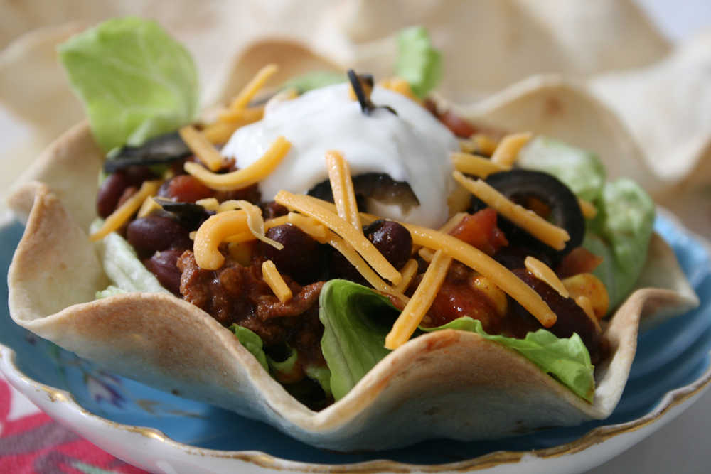 With pre-baked tortilla shells, some ground beef and a few items from the pantry, a colorful and fun chili dish can be pulled together in just 15 minutes.