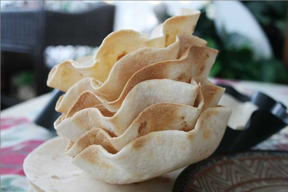Mini tortilla bakers were used to make these tortilla "bowls,"  but  small brioche molds work well, too.
