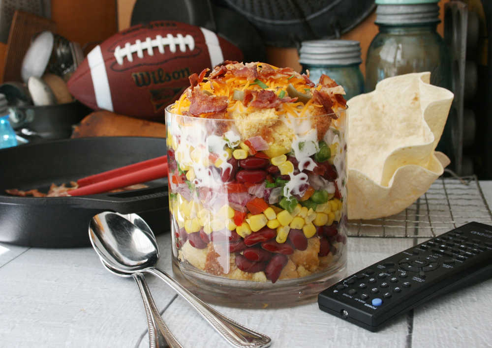 Southwestern Cornbread Layered Salad brims over with fresh flavor and vibrant color. For fun, the salad may be eaten from baked tortilla "bowls."