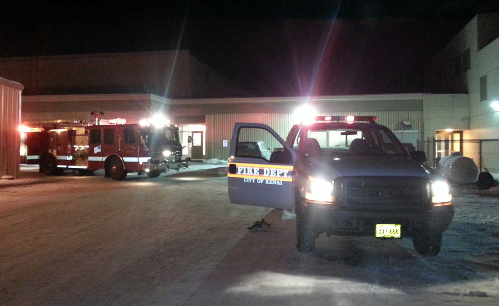 Photo by Dan Balmer/Peninsula Clarion Kenai Fire Department responded to a fire alarm Tuesday, Jan. 27, 2015 at Kenai Central High School. A heating unit pipe burst, which sent steam and water into an empty art classroom on the east wing of the school. Crews remained on scene for an hour to clean up.