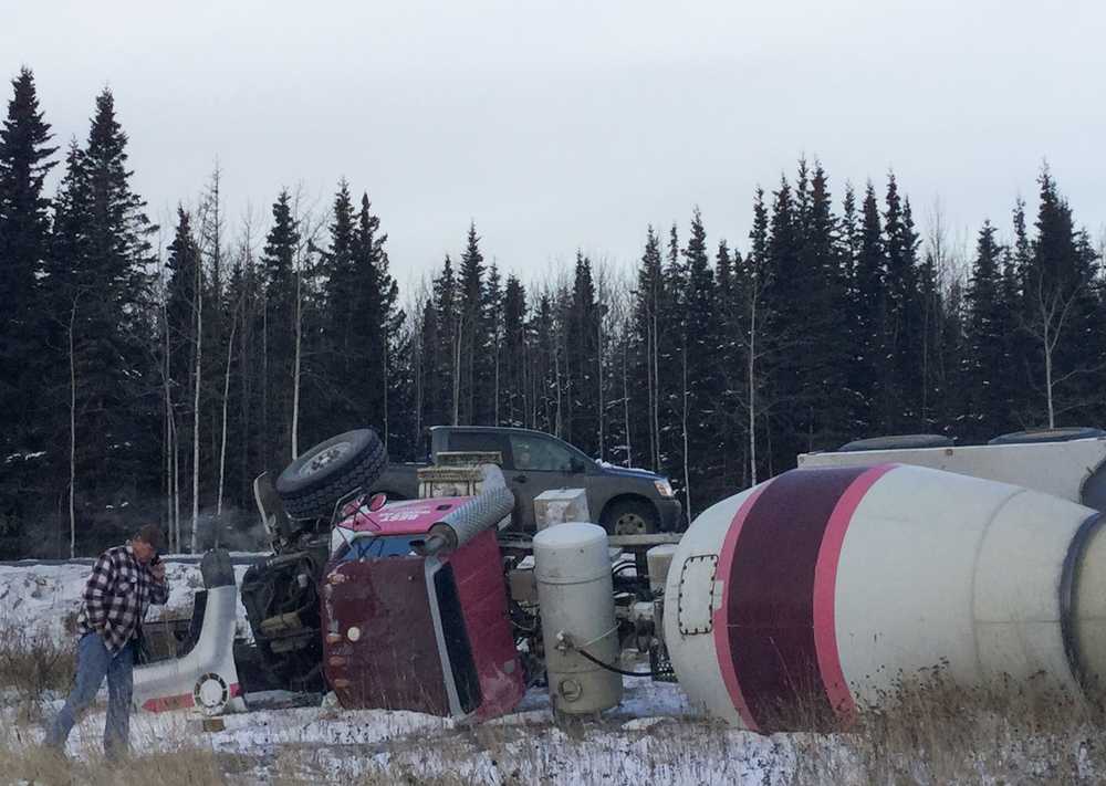 Driver hospitalized after cement truck overturns in Kasilof