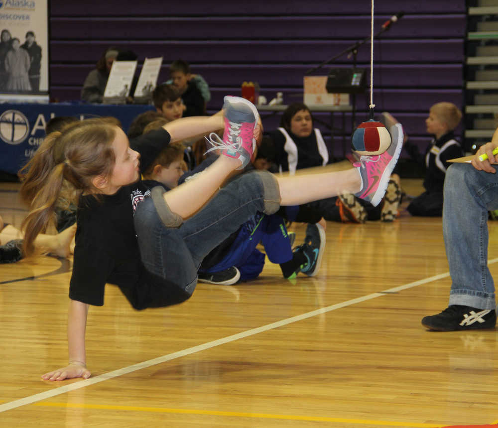 Youths compete Alaskan high kick event at NYO's.