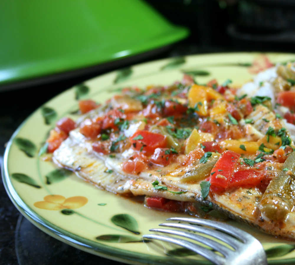 Colorful Brazilian Fish Tagine is flavored with coconut milk, an assortment of sweet bell peppers, onions, tomatoes and fresh cilantro.