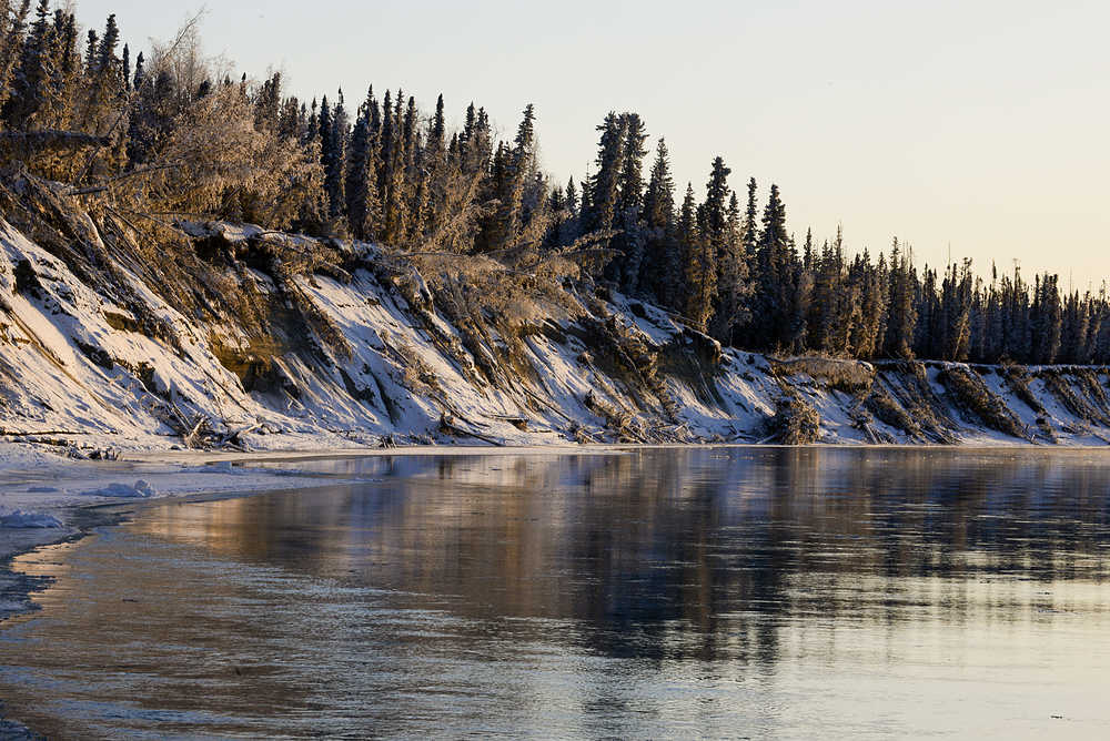 Photo by Rashah McChesney/Peninsula Clarion  The sun sets over a bluff on the Kenai River on Sunday Feb. 1, 2015 near Sterling, Alaska.