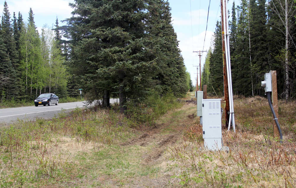 Photo by Dan Balmer/Peninsula Clarion An ATV trail and utility boxes line the side of Beaver Loop Road near the Dolchok Lane intersection. The road that connects Bridge Access Road and the Kenai Spur Highway is one of the few capital funding projects in the area paid for in Governor Bill Walker's preliminary budget.