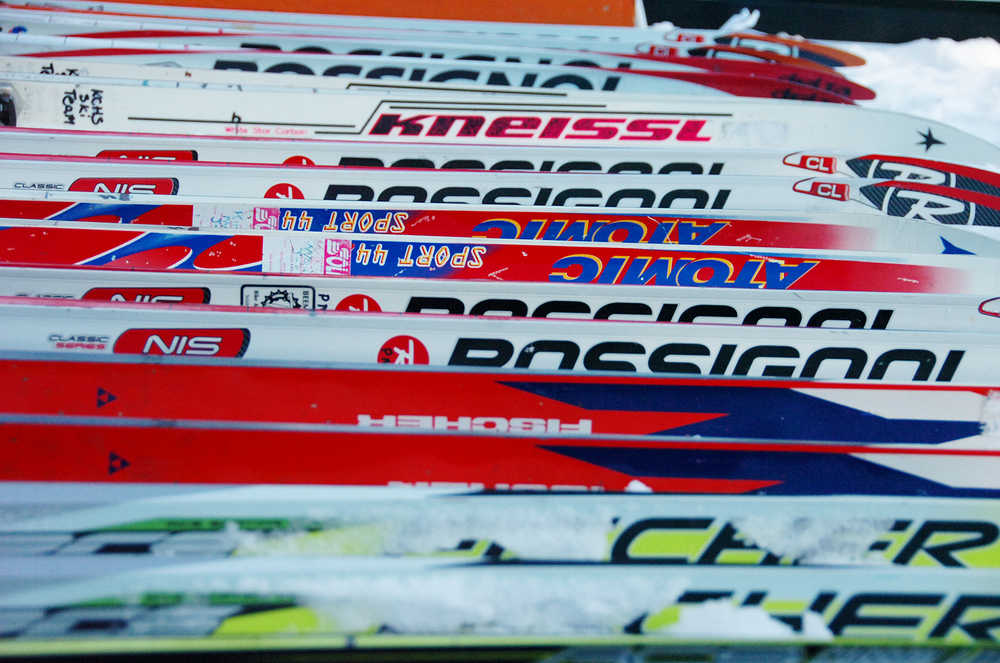 Photo by Joey Klecka/Peninsula Clarion A line of classic skis await racers in the exchange zone, Friday Feb. 6 at the Tsalteshi Trails in Soldotna.